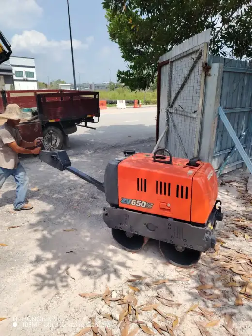 Hitachi orange roller delivered to customer site at Puncak Alam 2