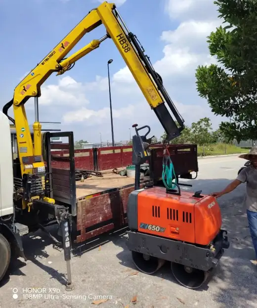 Hitachi orange roller delivered to customer site at Puncak Alam 4